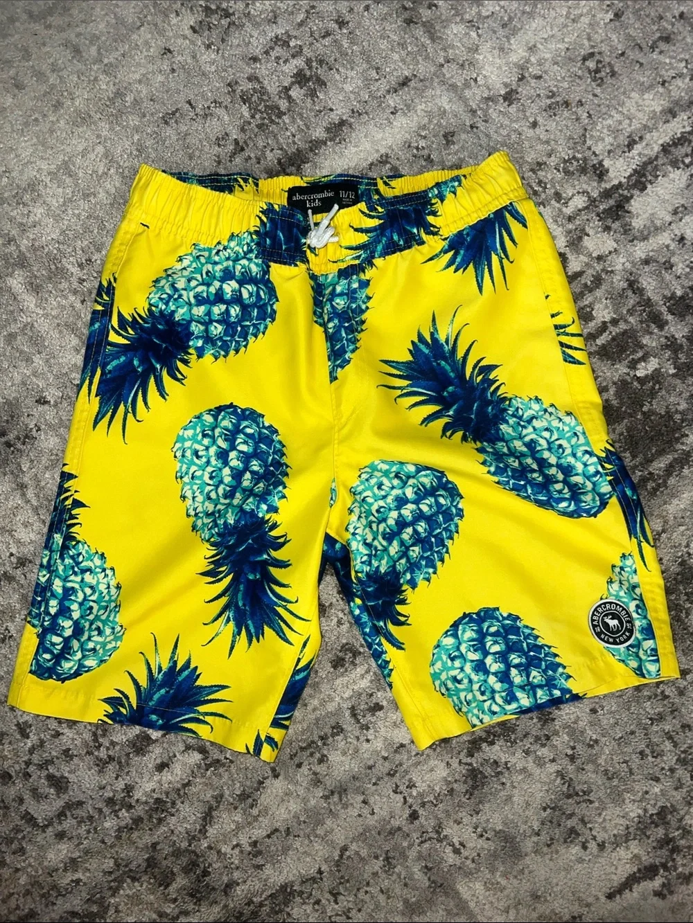 abercrombie kids Yellow & Teal Pineapple Swim Shorts. Two pair.